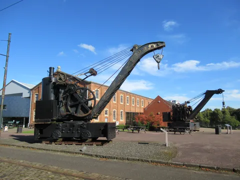 Historic cranes outside the exhibition hall at Summerlee Museum.