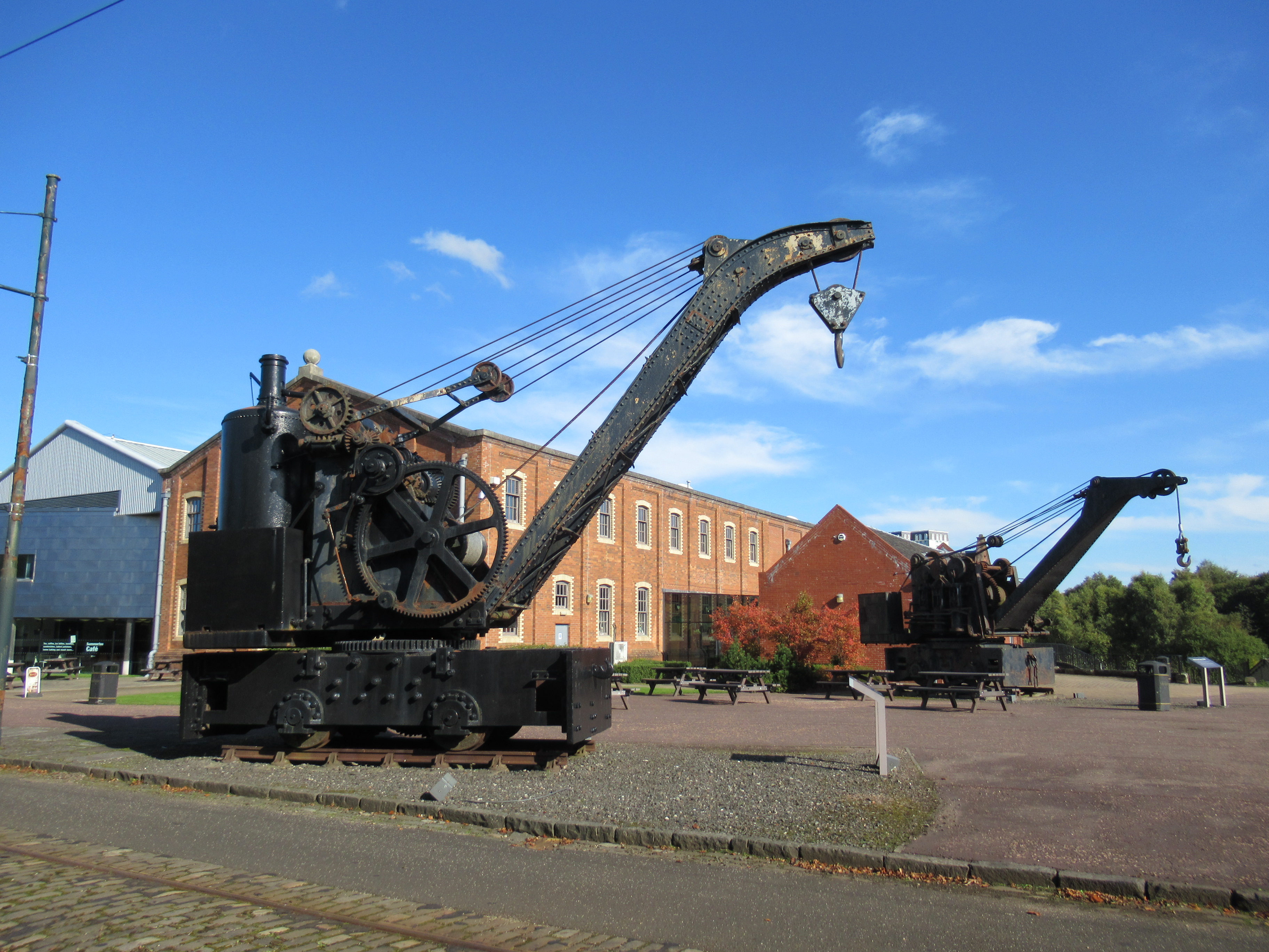 Historic cranes outside the exhibition hall at Summerlee Museum.